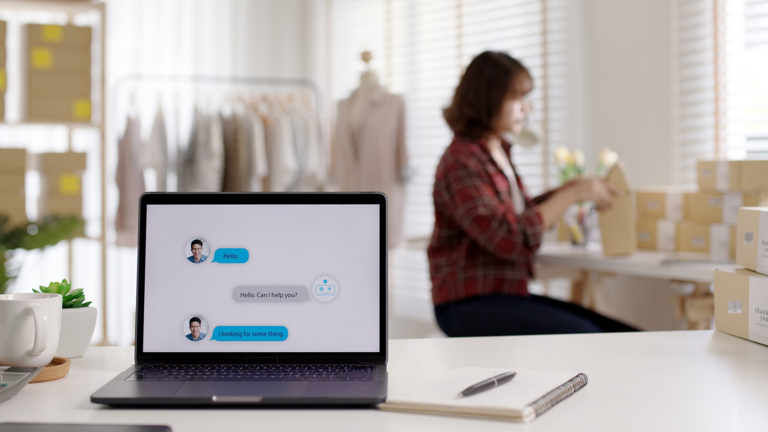 Chatbot conversation on laptop screen app interface with artificial intelligence technology providing virtual robotic assistant customer support and information for small business SME B2C concept.